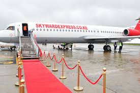 Skyward Express jet welcomed with a red carpet and roped walkway on the tarmac